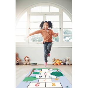 Hopscotch, happy and girl play in home having fun, enjoying games and relax in bedroom. Childhood, kindergarten and excited child balance for jumping game, playing and entertainment activity on floor